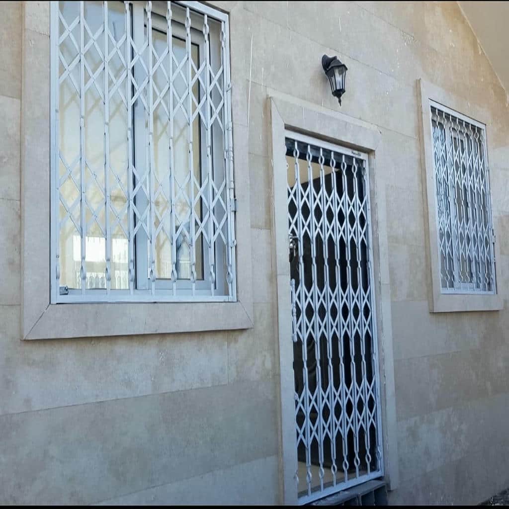 خرید درب حفاظ آکاردئونی دوگل در فردیس کرج