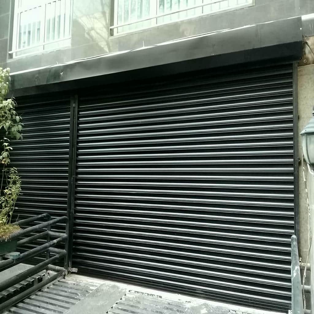 قیمت درب کرکره ای مغازه صنعتی وابسته به موتور و تیغه
