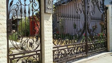 درب ریلی فلزی باغ با رنگ مشکی کوره ای و ریل مقاوم